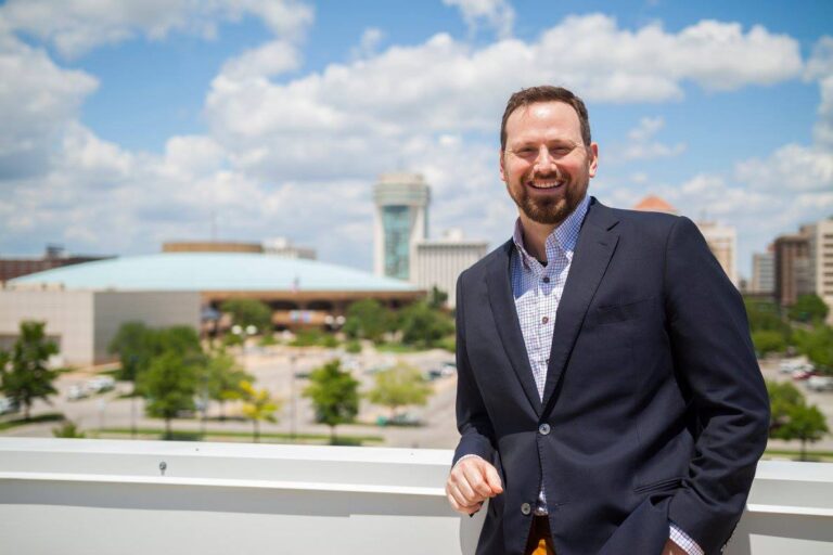 Ryan W. Gates with the Wichita, Kansas skyline in the background